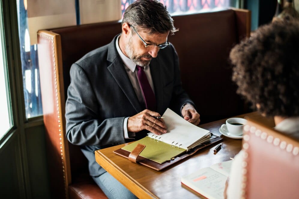 lawyer taking down meeting notes