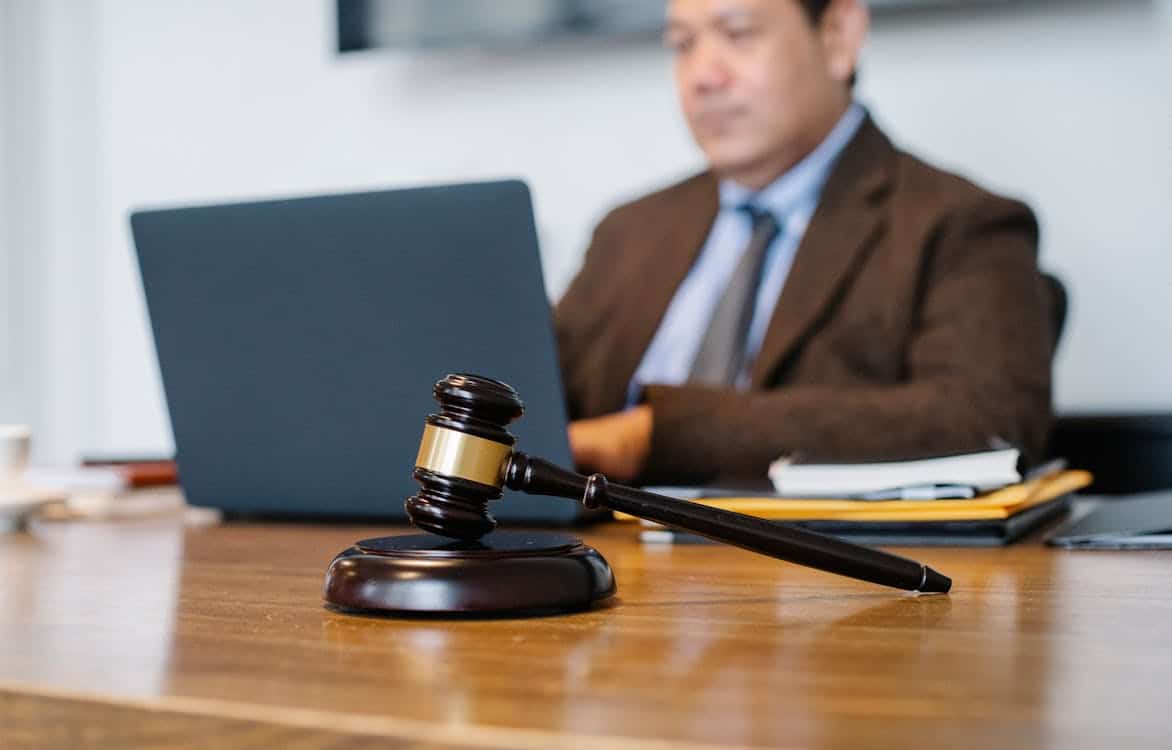 male judge working on laptop in the office