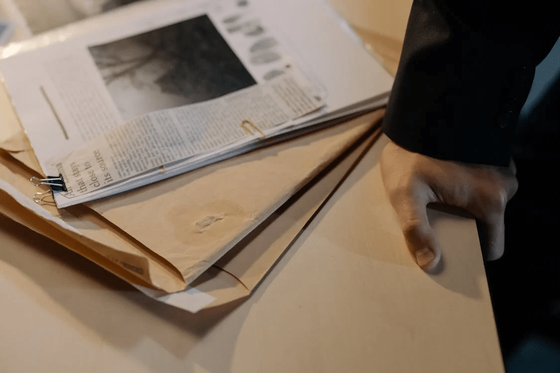 lawyer wearing blazer next to evidence on table