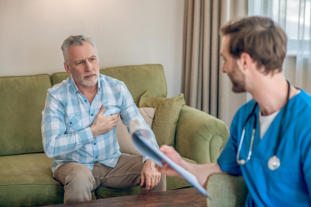 adult male patient consulting a doctor