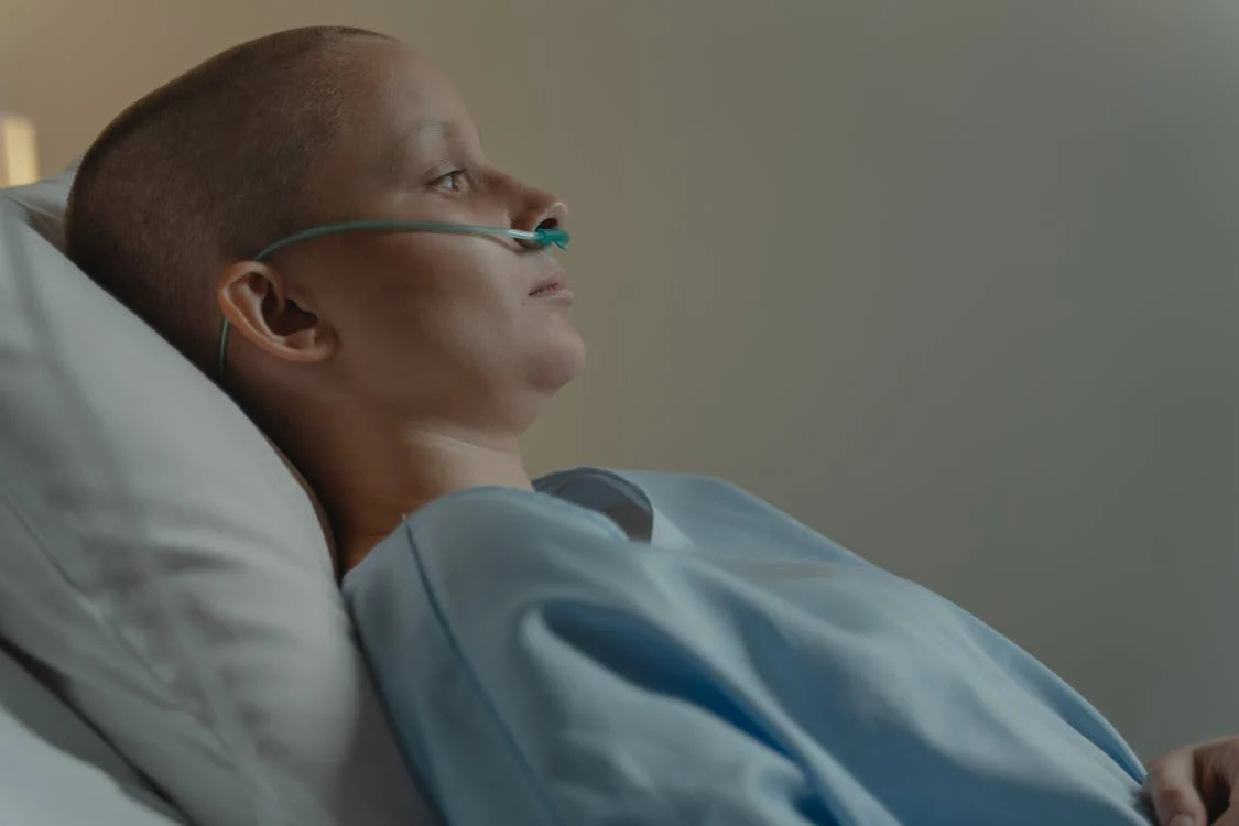 cancer patient lying on hospital bed